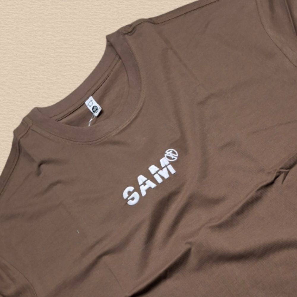Brown Oversized Premium Cotton T-Shirt with Utility style chest pocket with a contrast fabric patch and graphic accentsPocket